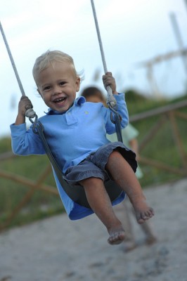 preschool boy on swing