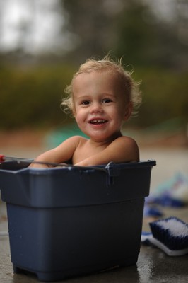 preschooler in a bucket