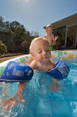 Toddler swimming in pool
