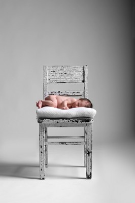 infant baby sleeping on chair