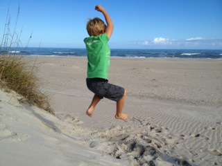 Ben jumping in sand