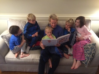 Sheshe reading to grandkids