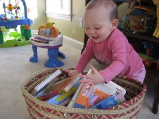 Toddler selecting books for reading